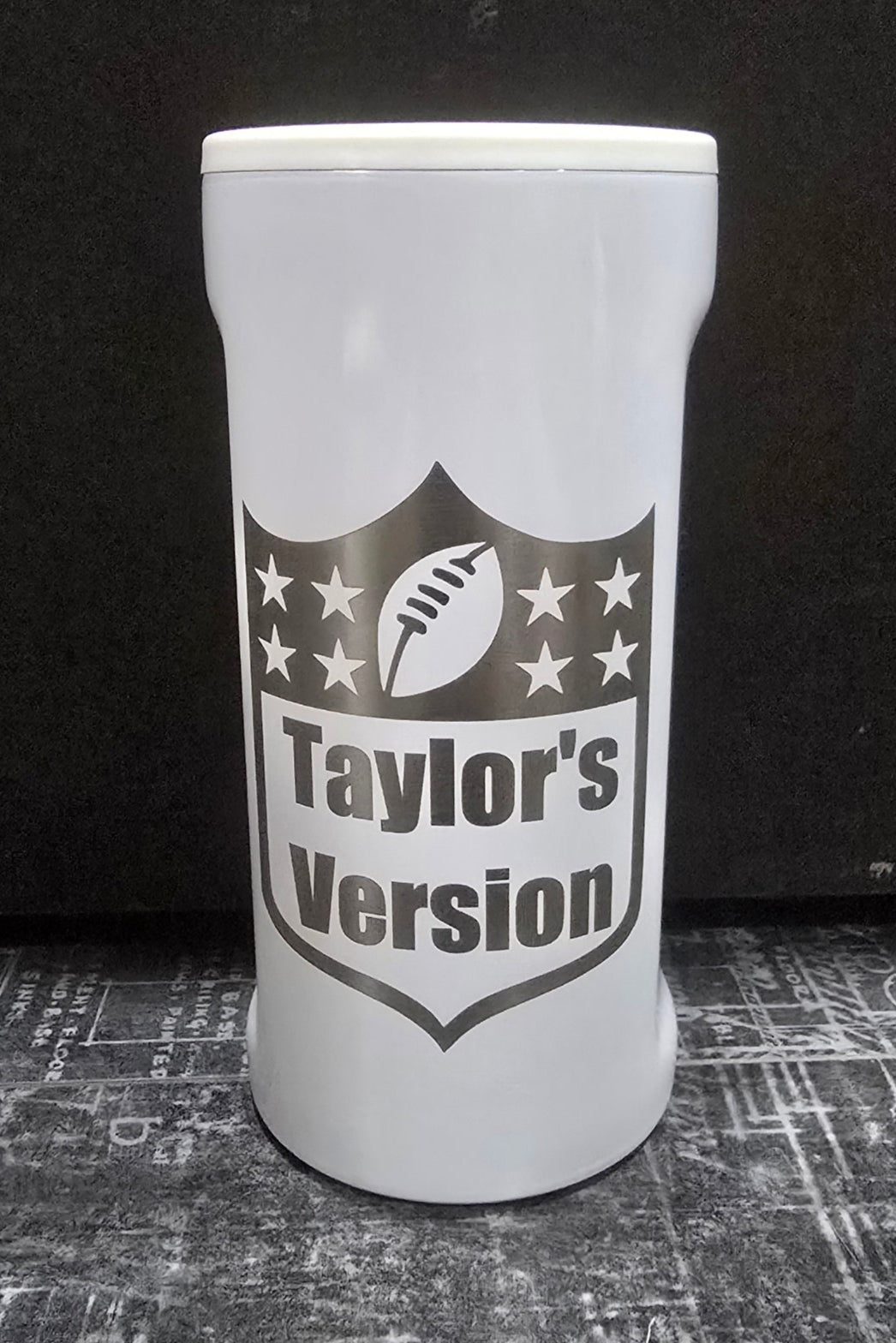White slim koozie cup with NFL Logo and Taylor&